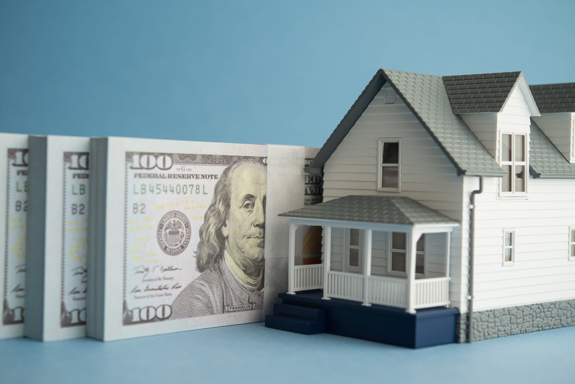 House and US dollar banknotes